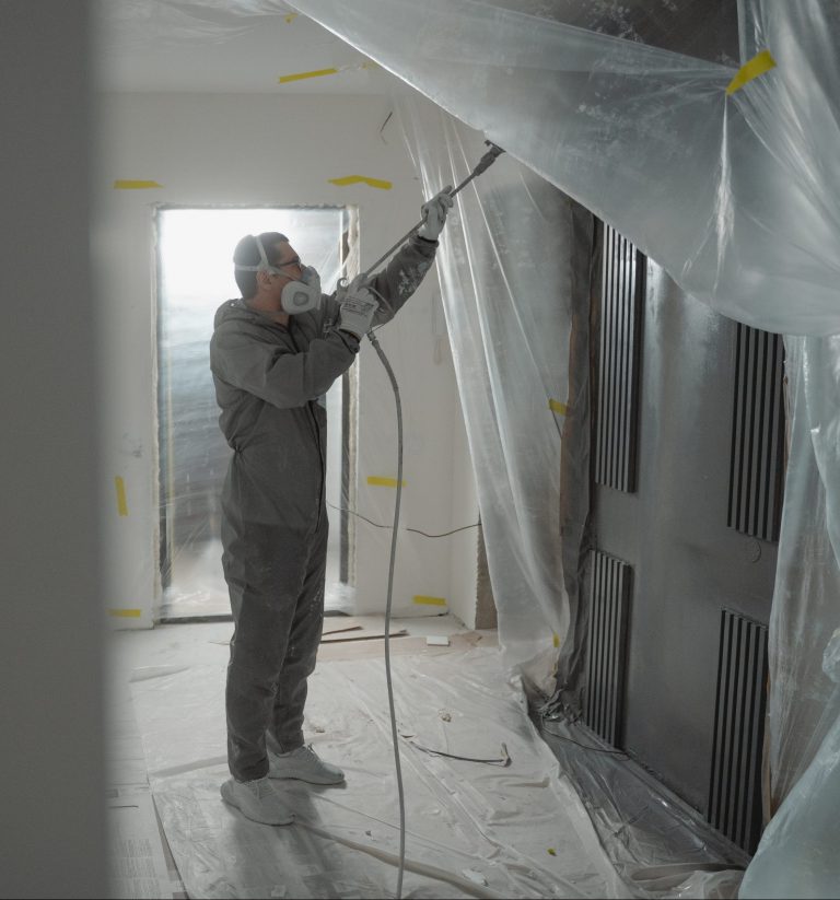 Man repainting damaged area